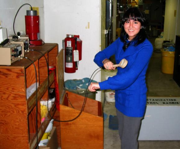 Maria Jose Crousillat using a geiger counter to detect any removable radiation particles
